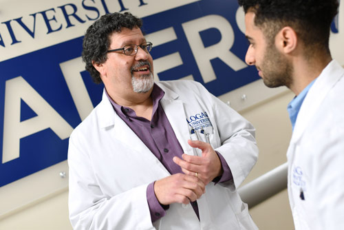 An instructor conversing with a student